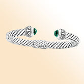 Handcrafted sterling silver cable cuff bracelet with green quartz and Balinese scroll details, elegant artisan jewelry for everyday wear.